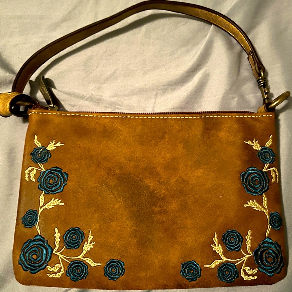 Embroidered turquoise flowers on leather wristlet, fits over the shoulder too